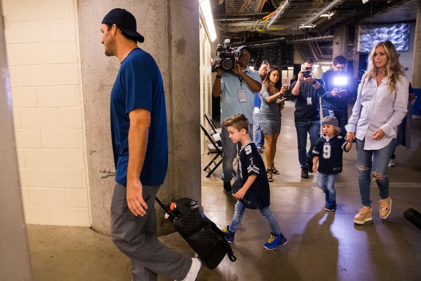 Former Dallas Cowboys quarterback Tony Romo walks in to the Dallas Mavericks locker room at...