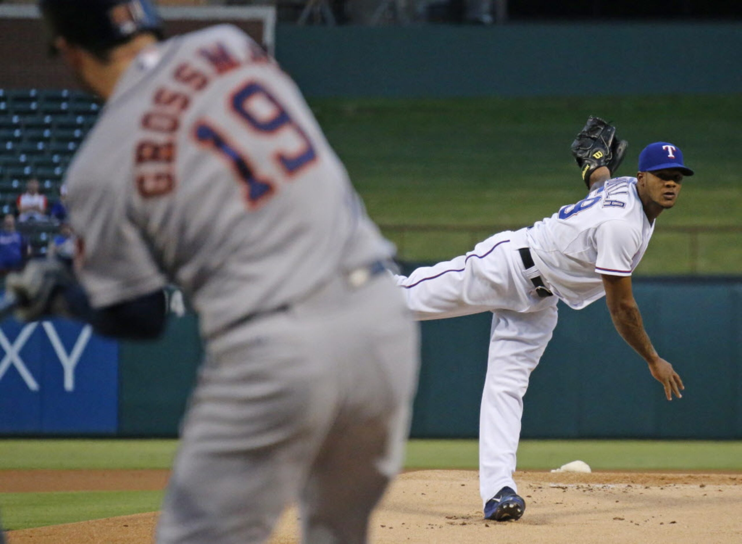 Texas starting pitcher Lisalverto Bonilla throws a first-inning pitch to Houston's Robbie...