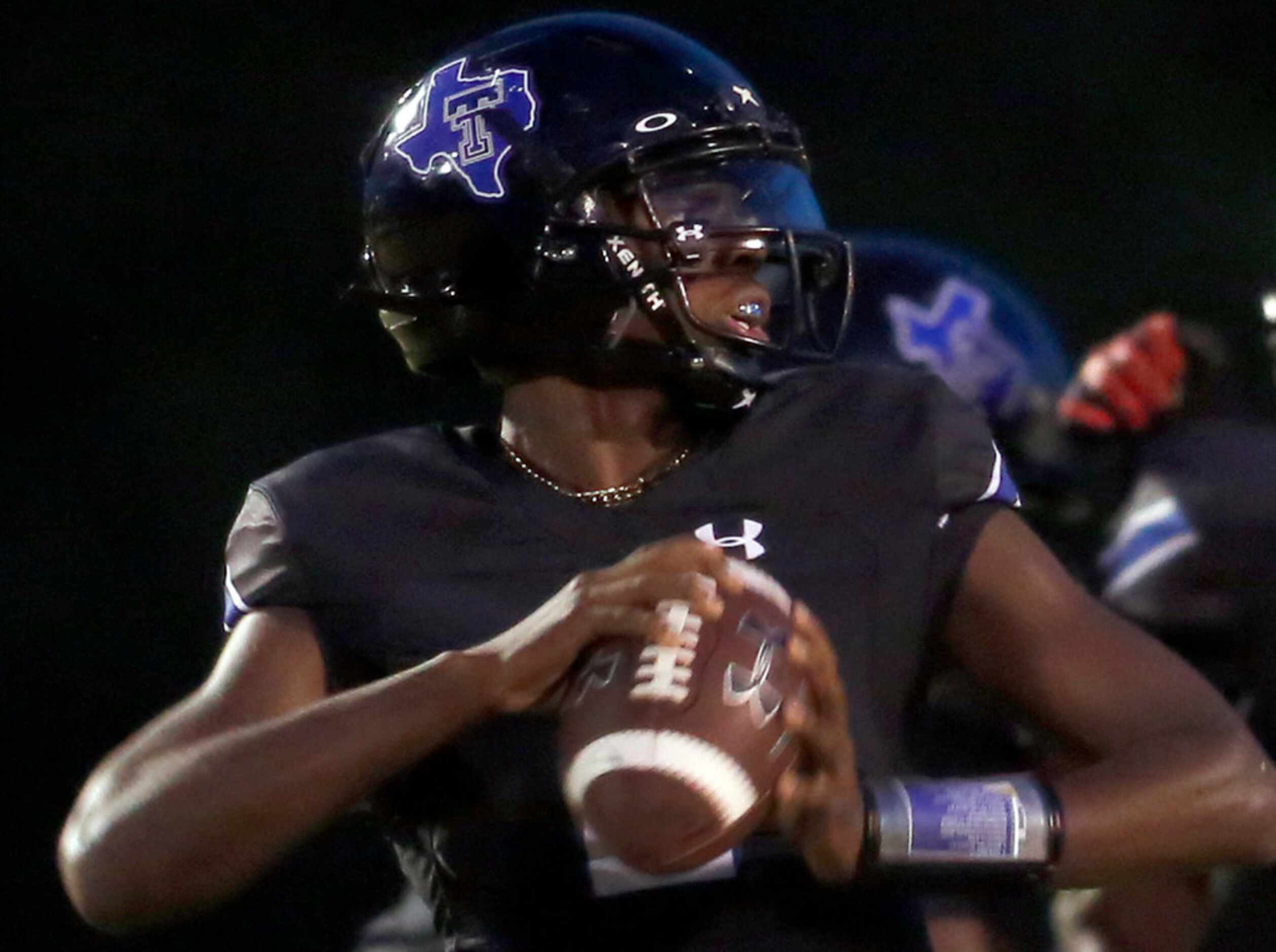 Trinity Christian Cedar Hill quarterback Shedeur Sanders (2) looks to make a pass downfield...