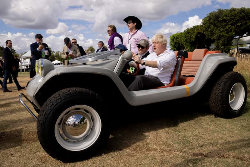 (From left in car) Phillip Sarofim, chairman of Meyers Manx, and former British Prime...