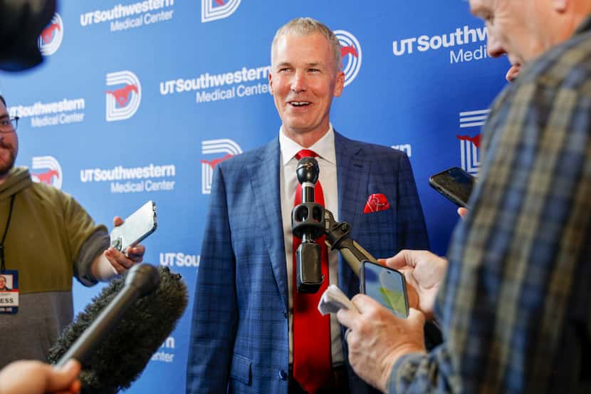 SMU head men's basketball coach Andy Enfield speaks with reporters after an introductory...
