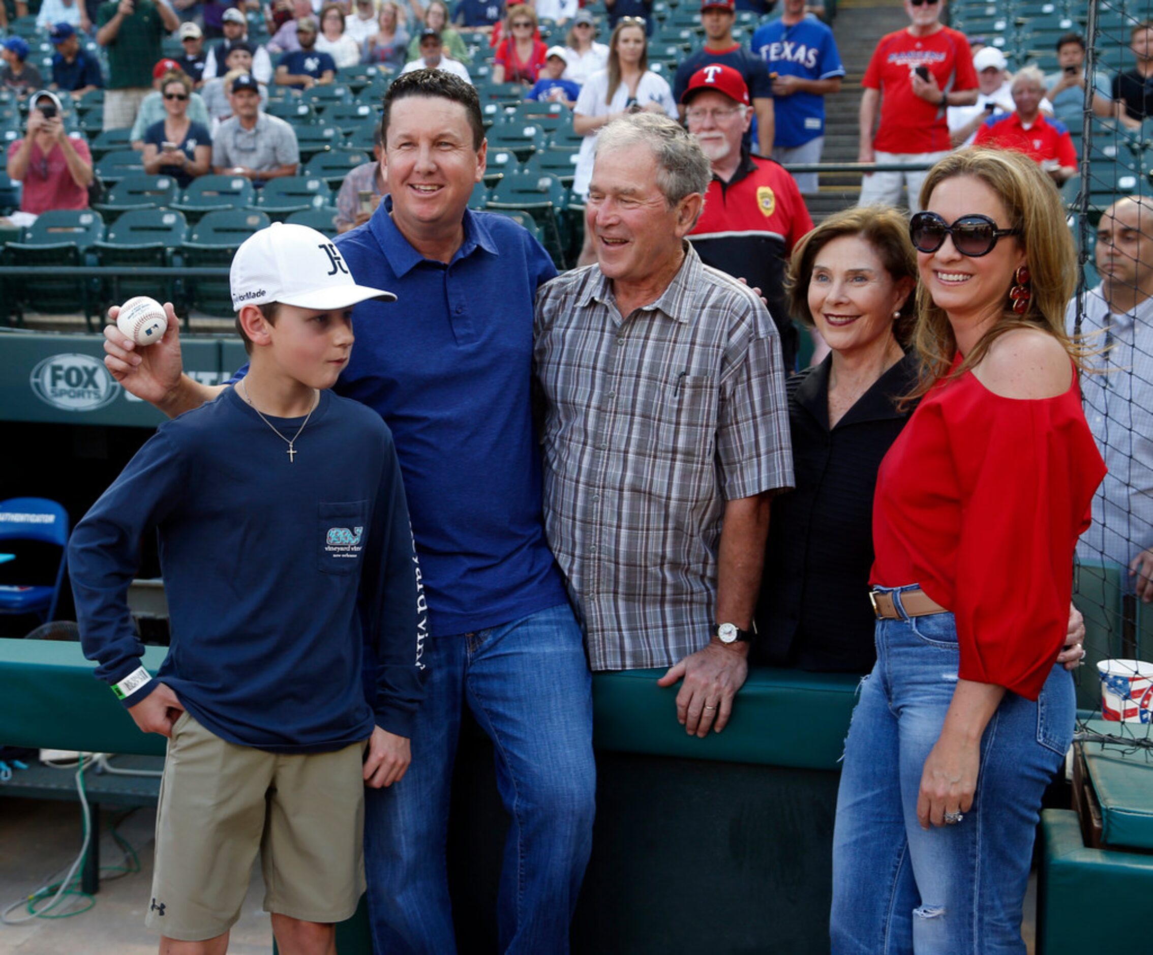 George W. Bush and Laura Bush meet PGA golfer JJ. Henry, second from left, his son Connor...