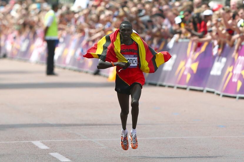 LONDON, ENGLAND - AUGUST 12: Stephen Kiprotich of Uganda celebrates as he approaches the...