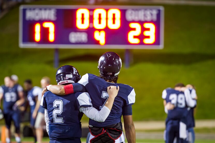 Allen quarterbacks Mitchell Jonke (2) and Seth Green (7) leave the field following a 23-17...