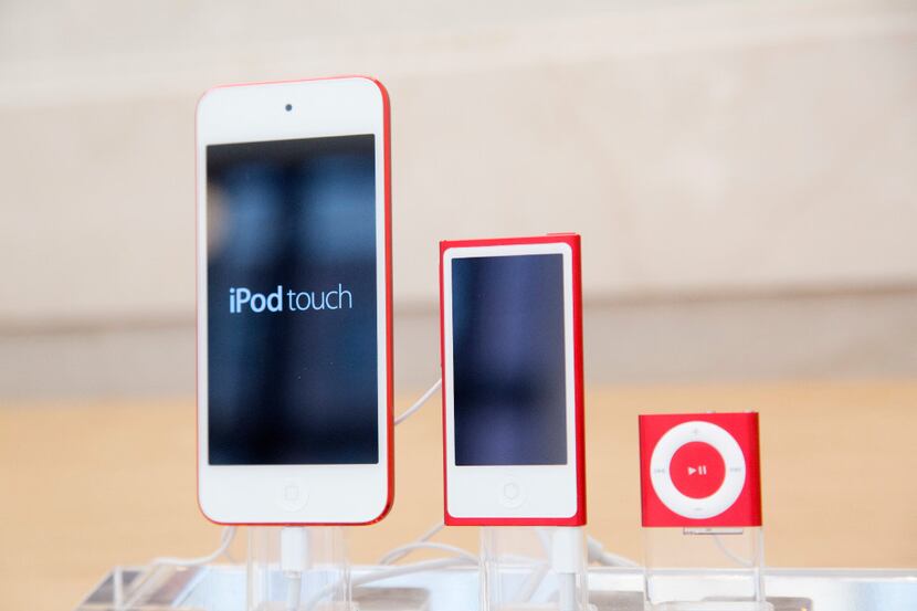 In this June 11, 2015, file photo, from left, an iPod, iPod Nano and iPod Shuffle are...