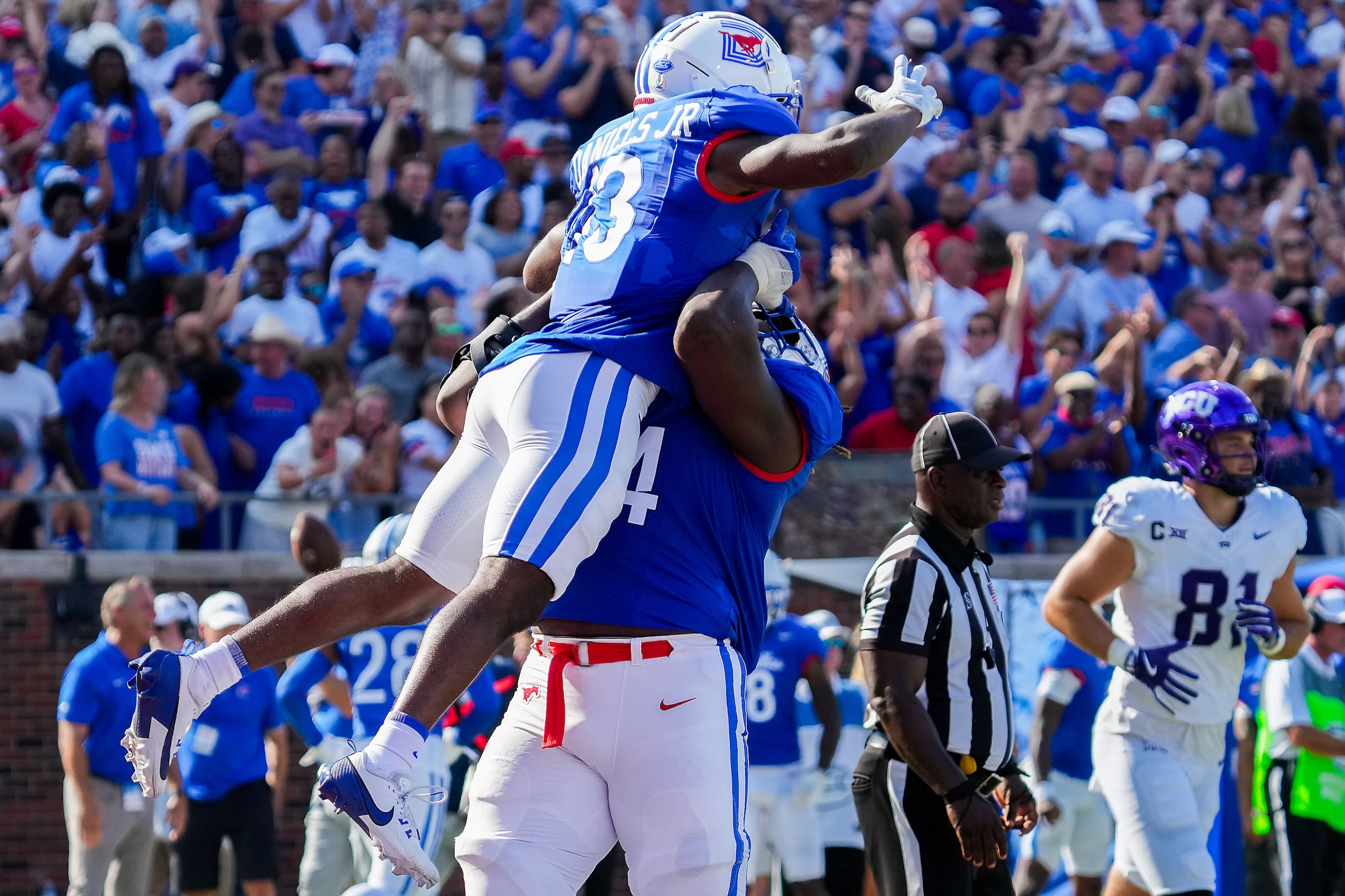 SMU wide receiver Roderick Daniels Jr. (13) celebrates with offensive lineman Savion Byrd...