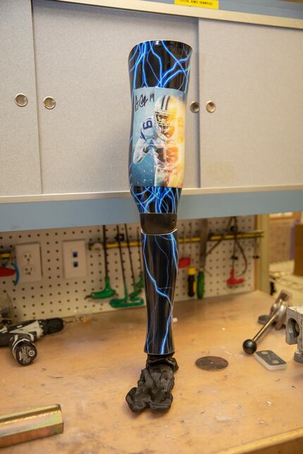 The prosthetic leg of Julian Perez that features a signed Amari Cooper T-shirt integrated...
