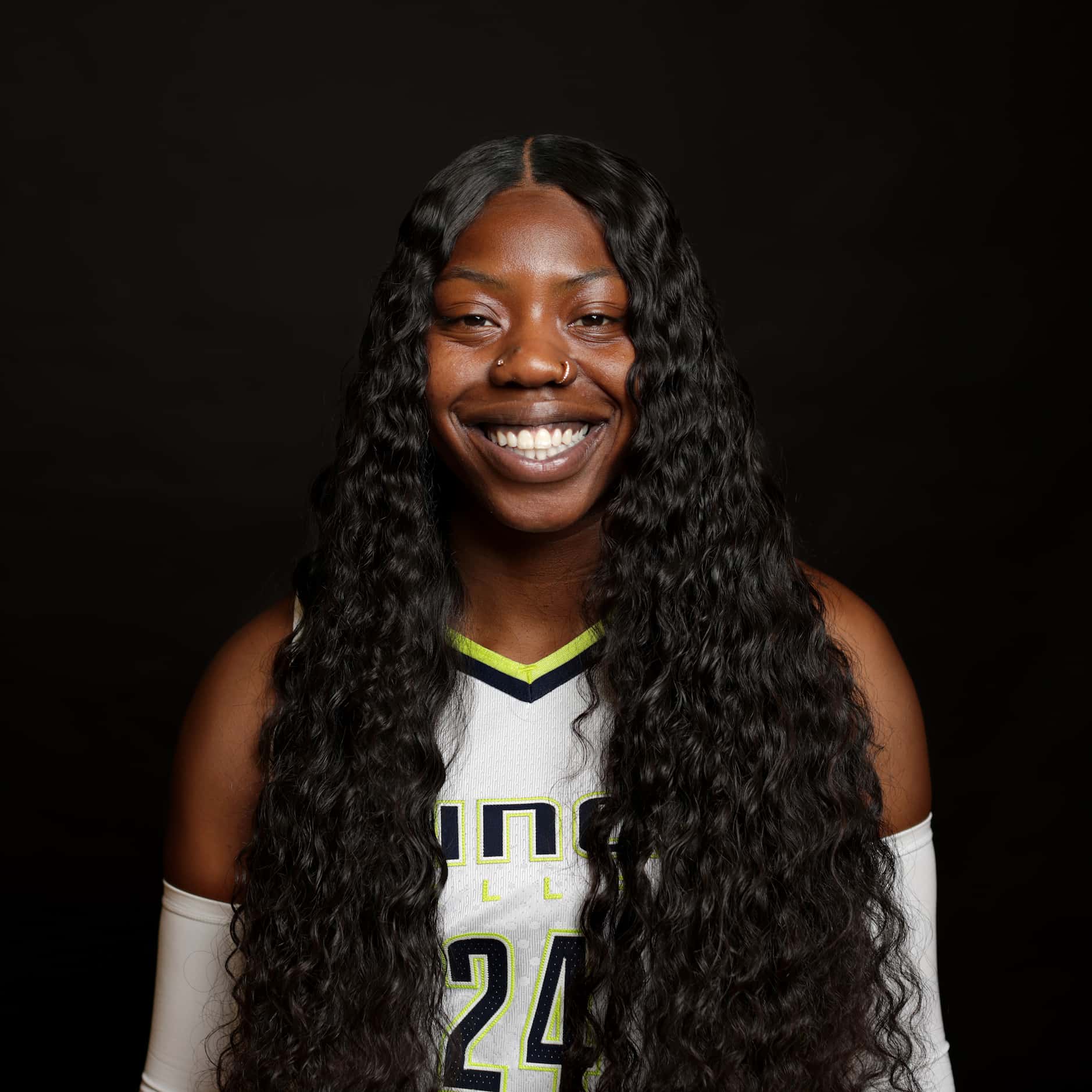 #24 Arike Ogunbowale with The Dallas Wings poses for a photograph at College Park Center in...