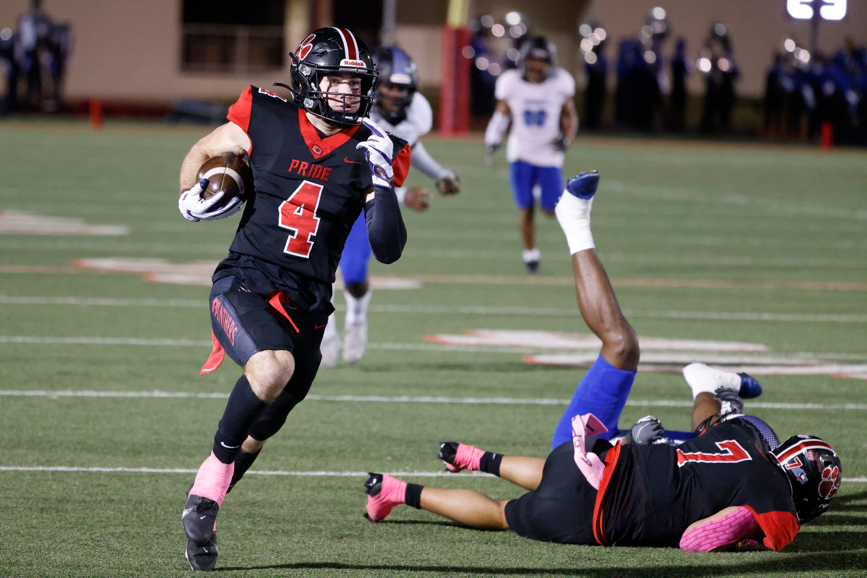 Colleyville Heritage’s Hogan Wasson (4) returns a punt for a touchdown against Mansfield...