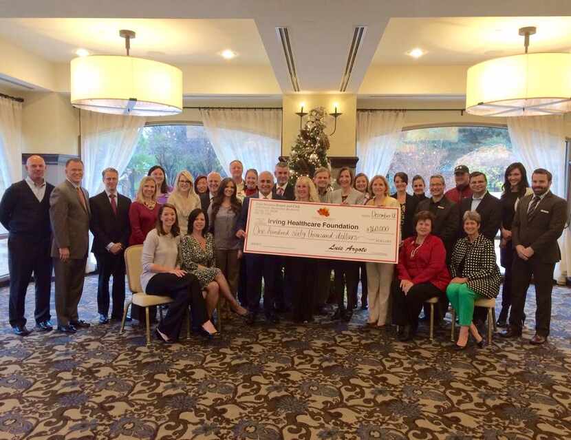 
The Four Seasons Resort and Club Dallas at Las Colinas presents a check for $160,000 to the...