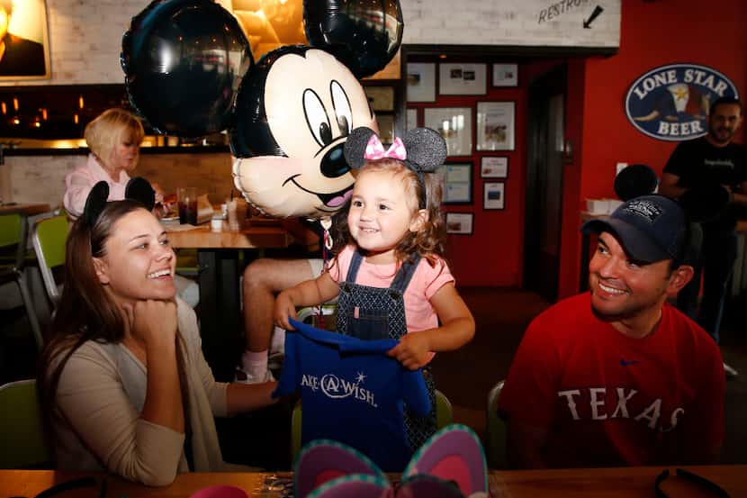 Ruben and Kristen Martinez sit with their daughter Mia Martinez, 3, who was diagnosed with a...