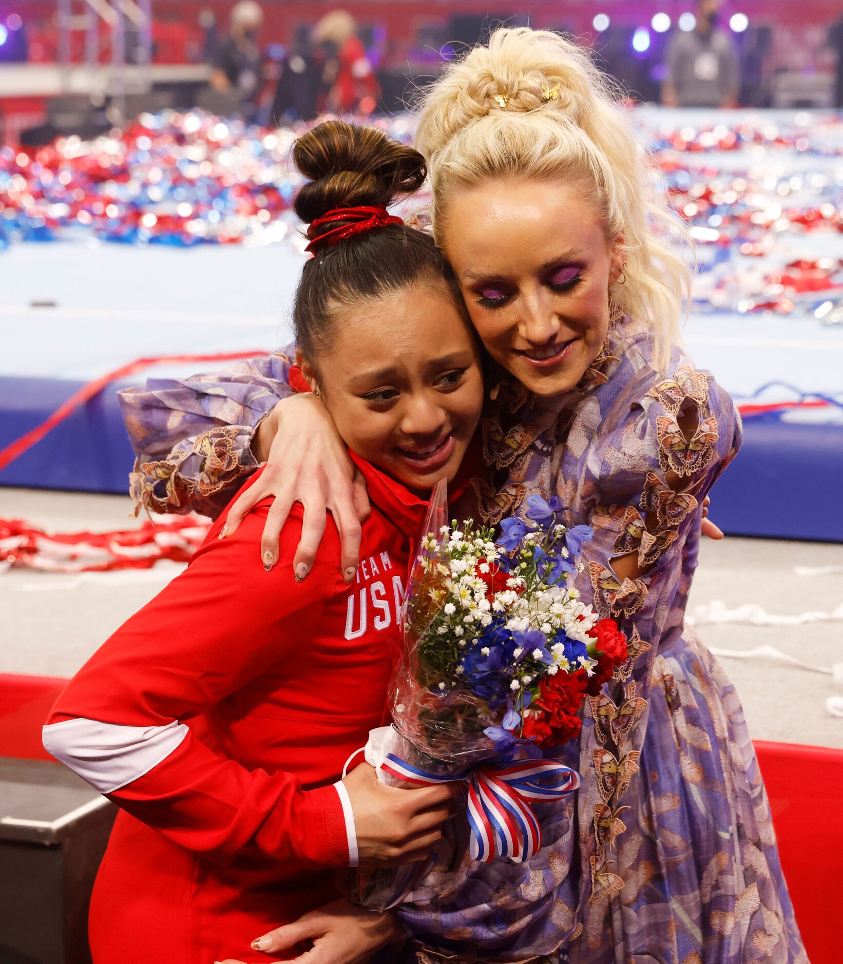 Emma Malabuyo and Nastia Liukin hug after during day 2 of the women's 2021 U.S. Olympic...