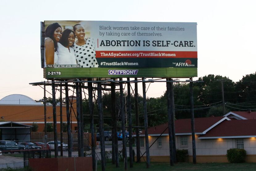 
A billboard put up by the Dallas-based Afiya Center proclaims "abortion is self-care" and...