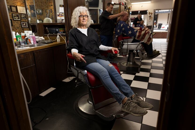 Owner Linda Marshall poses in her chair at Palace Barbershop in McKinney on Thursday, March...