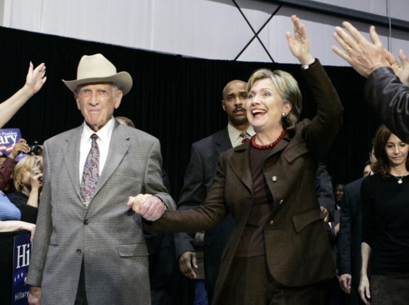 Former U.S. Rep. Jack Brooks (left) escorts Hillary Rodham Clinton to the stage at the...