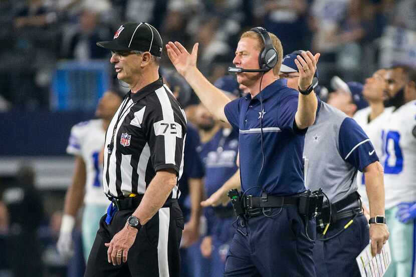 Dallas Cowboys head coach Jason Garrett argues a call during the second half of an NFC...
