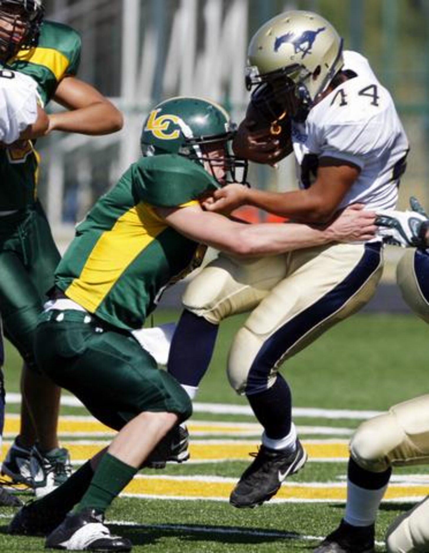 McKinney Christian freshman Trevor Hopkins (44) is stopped by Frisco Legacy Christian's John...