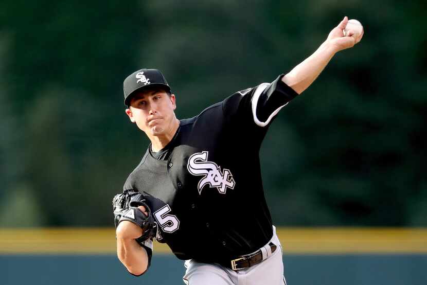 DENVER, CO - JULY 07: Starting pitcher Derek Holland #45 of the Chicago White Sox pitches in...