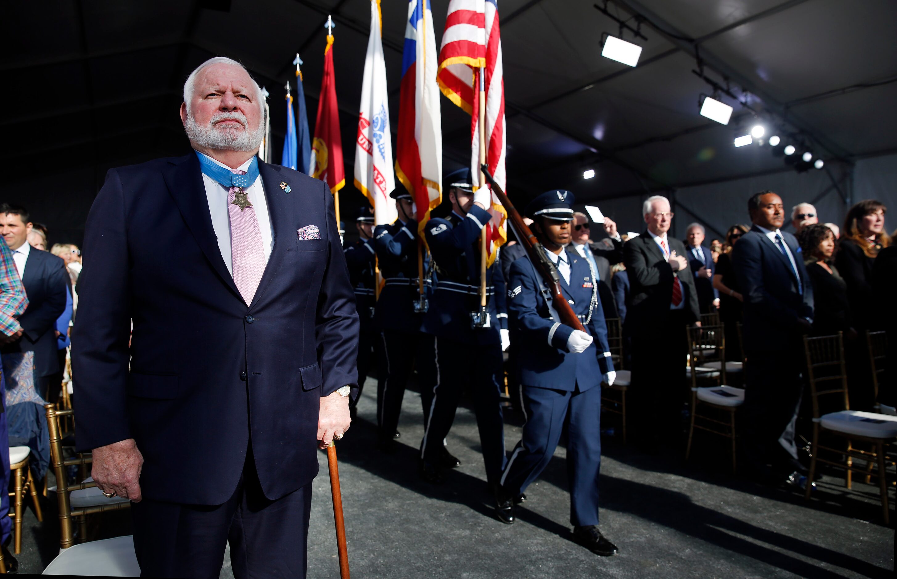 U.S. Navy Lt. Commander Mike Thornton of Dallas (left), a Medal of Honor recipient, stands...