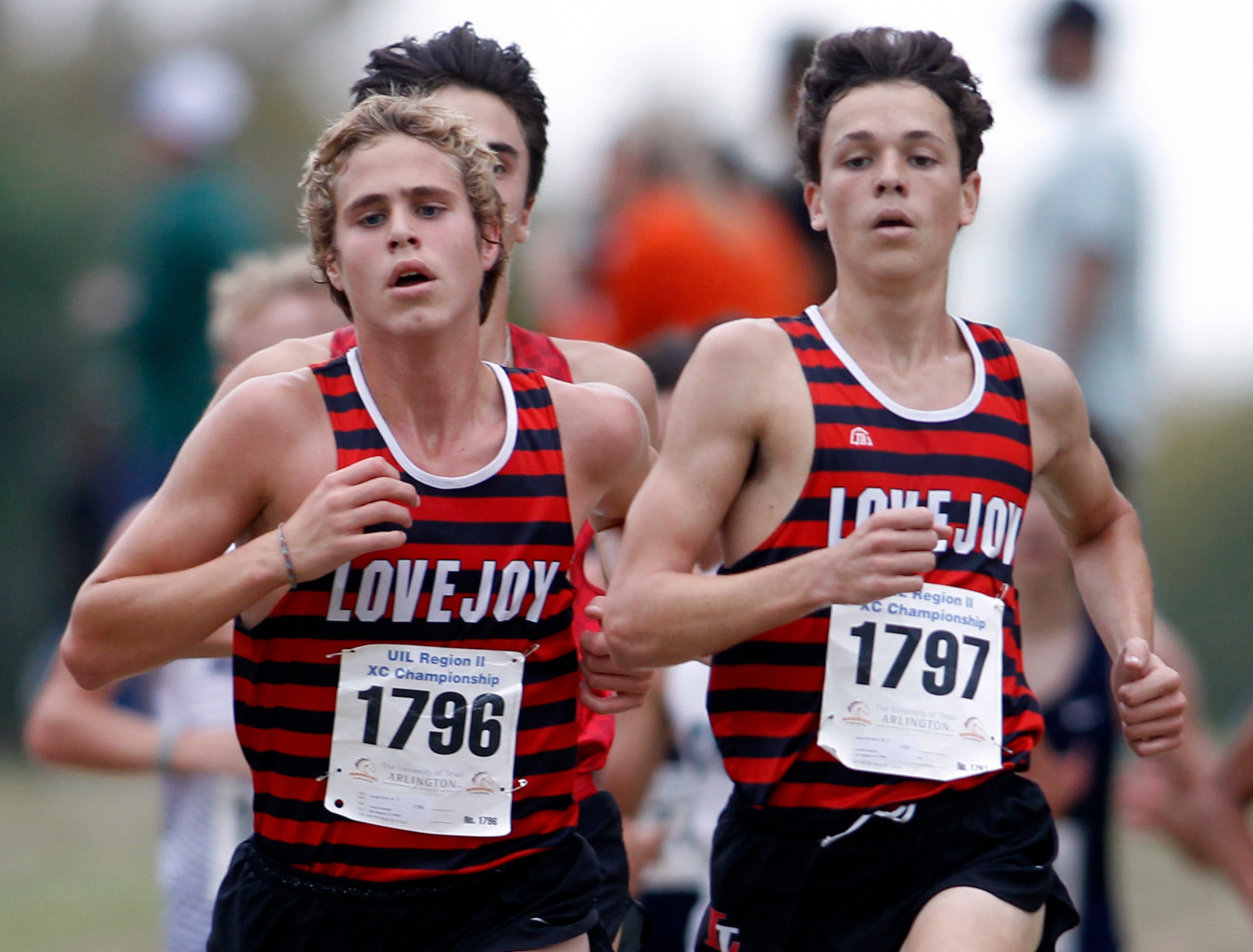 Lucas Lovejoy teammates Joseph Reid (1796), left, and Aaron Wimbish (1797) run side by side...