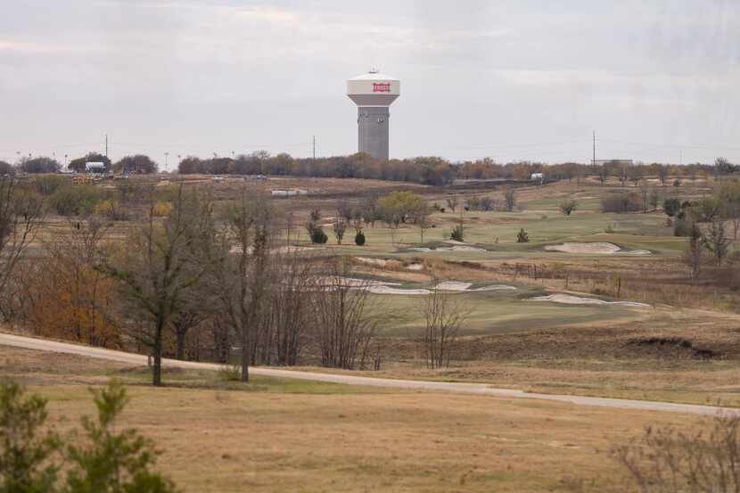 Frisco's distinctive water tower and a golf course are visible from the Omni PGA Frisco resort.