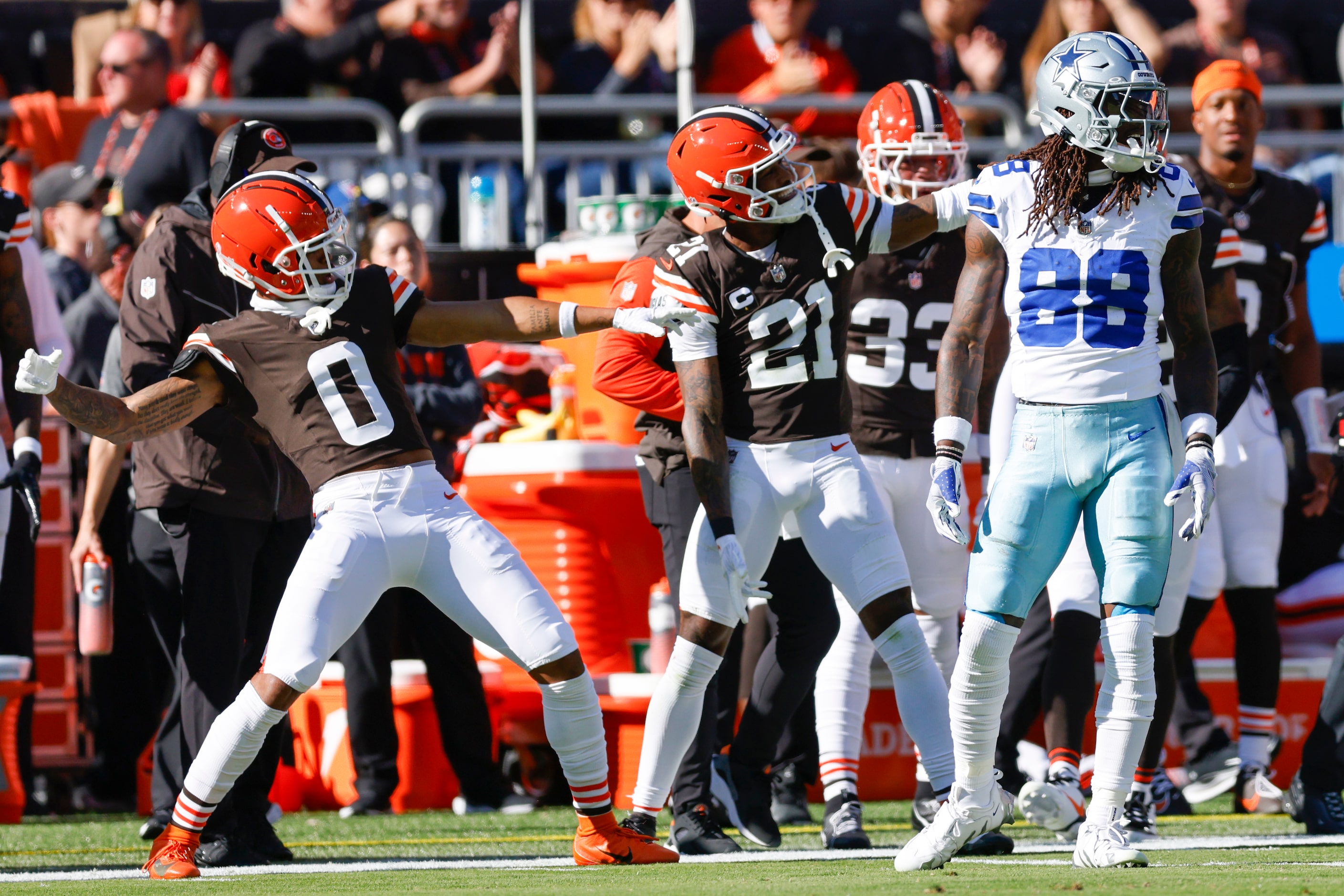 The Cleveland Browns defense celebrates after an incomplete pass intended for Dallas Cowboys...