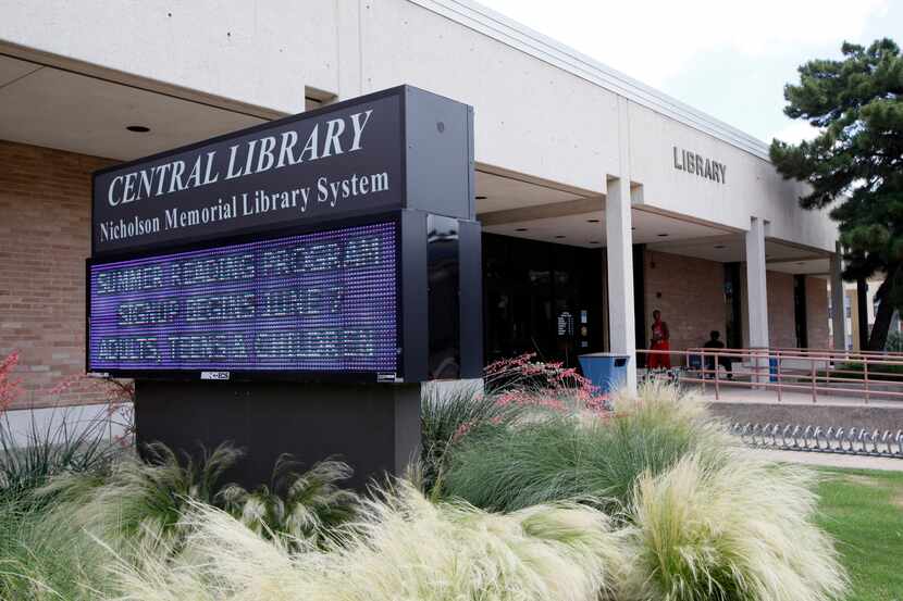 A digital board outside Garland's Central Library promotes a summer reading program.