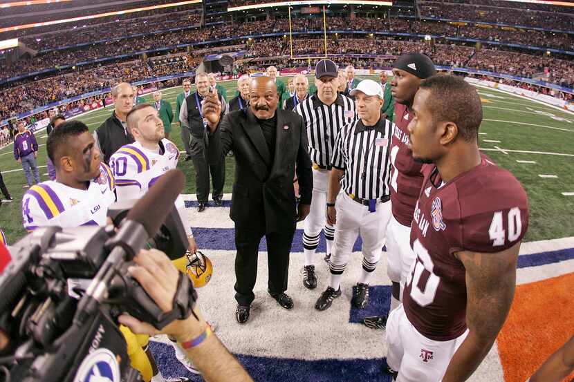 Jim Brown flipped the coin at the 75th anniversary of the Cotton Bowl Classic between LSU...