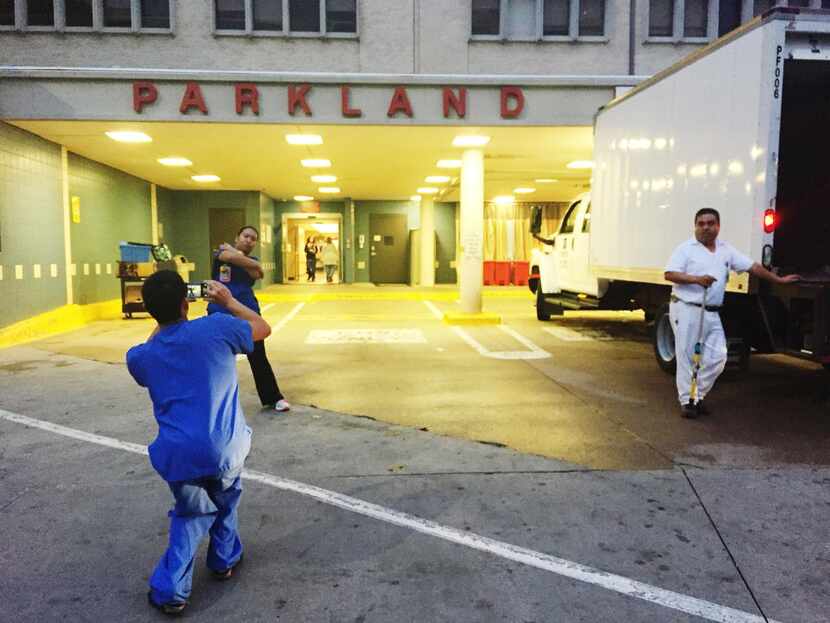 Employees posed  for photos outside the entrance to the emergency room at the old Parkland...