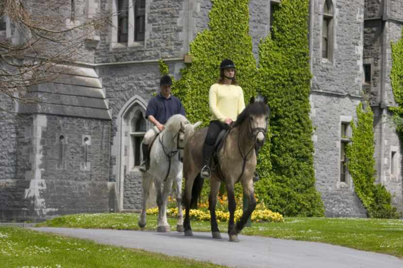 Horseback riders explore the grounds of Ashford Castle in County Mayo, Ireland.