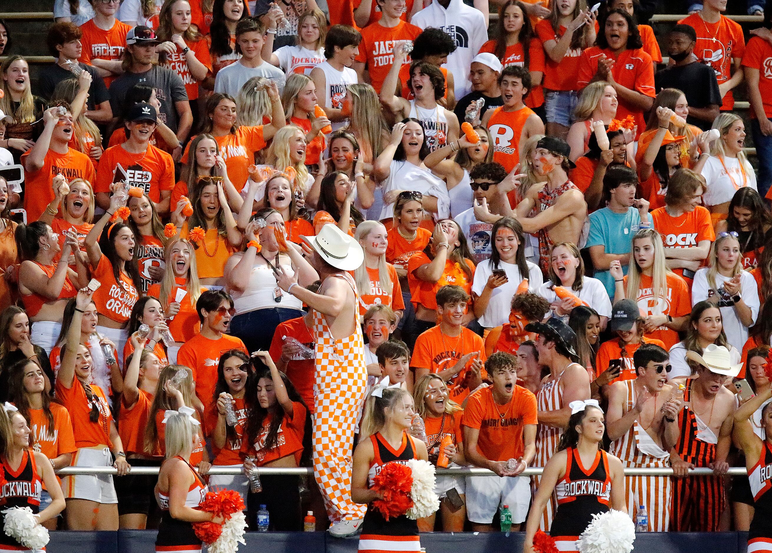 The Rockwall High School student section celebrates a touchdown during the first half as...