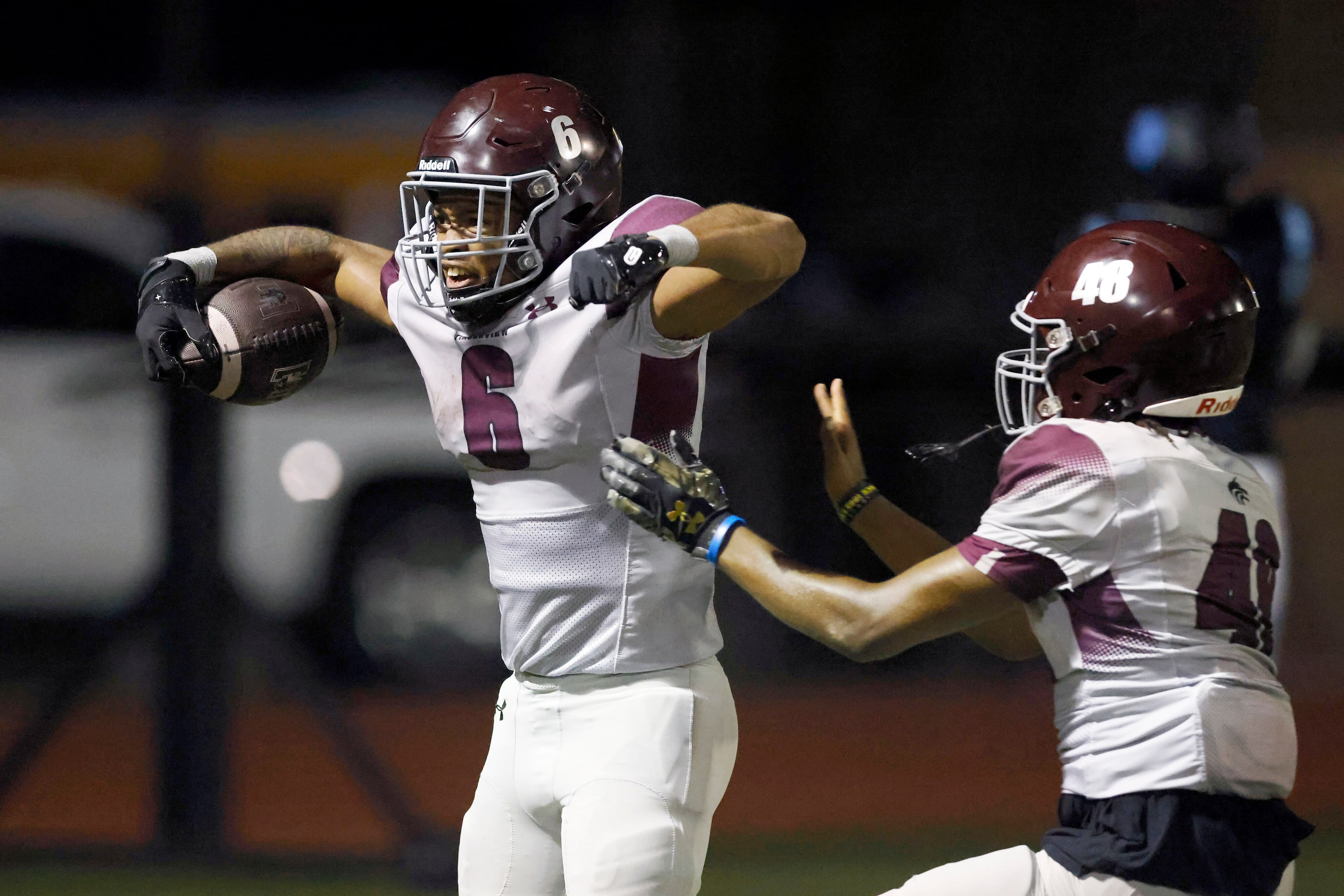 Mansfield Timberview running back Jaylon Woods (6) flexes after scoring a touchdown...