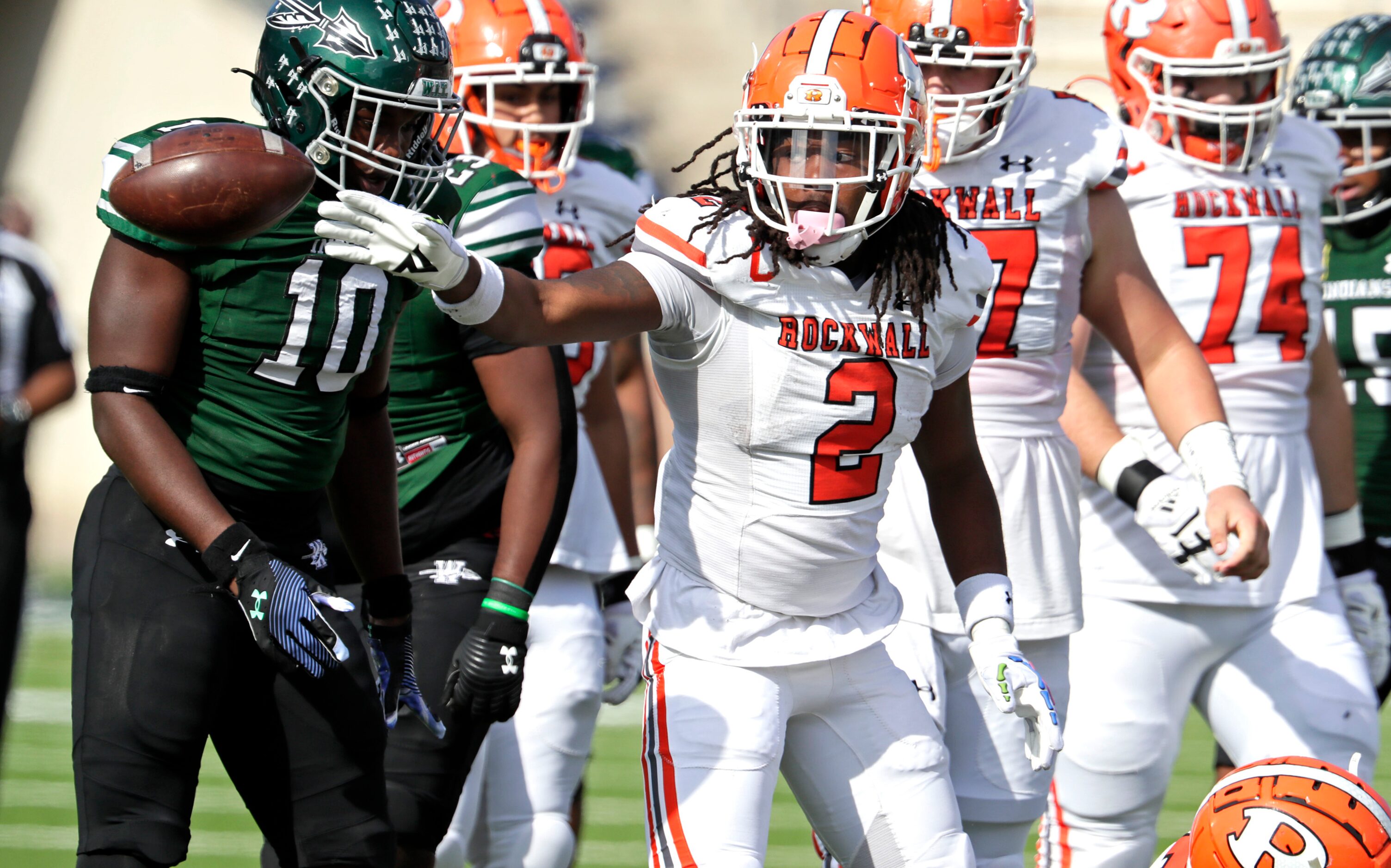 Rockwall High School running back Ashten Emory (2) signals first down after a run in the...