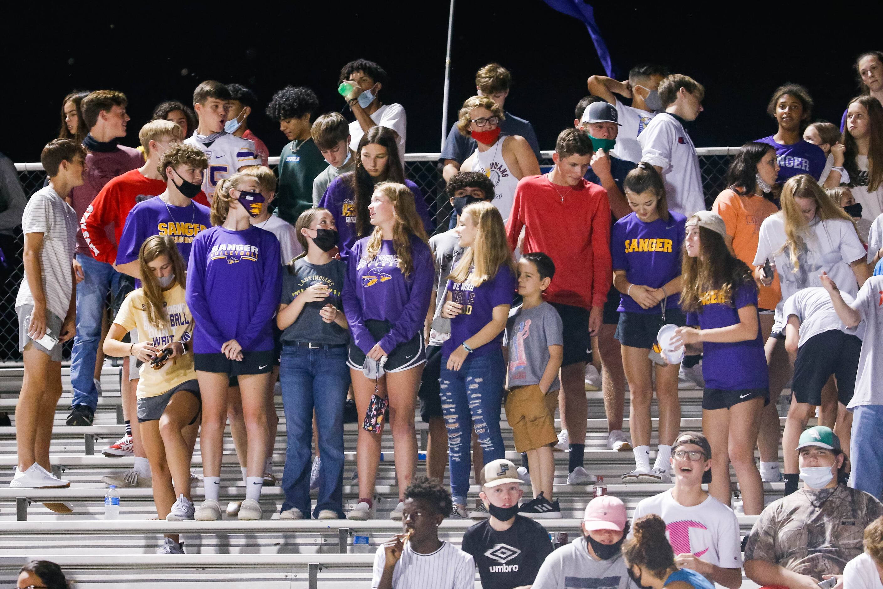 Sanger High School students watch a game against Lake Worth High School's during the first...