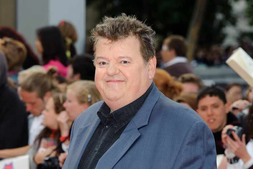 ARCHIVO - Robbie Coltrane llega a Trafalgar Square, en el centro de Londres, para el estreno...