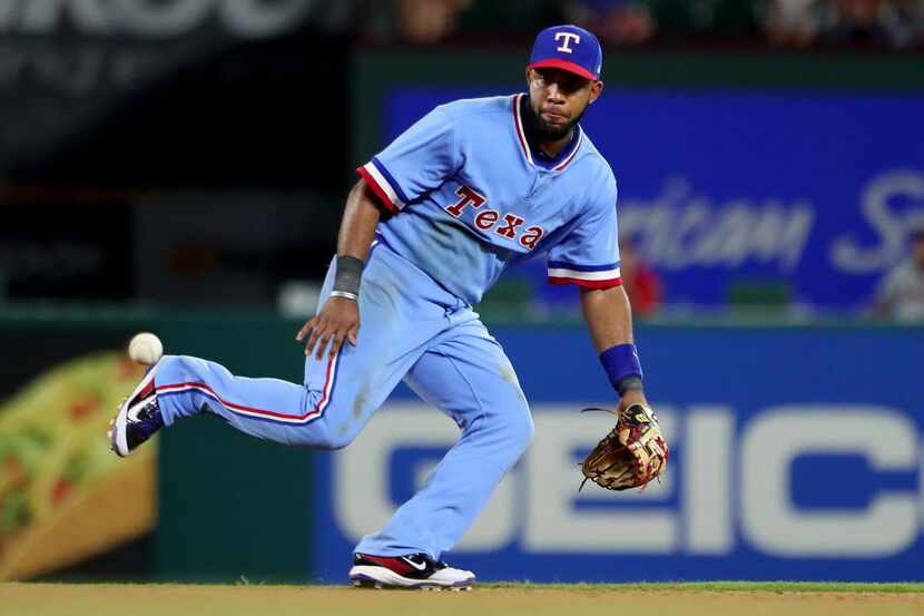 ARLINGTON, TX - JULY 08:  Elvis Andrus fields a ground ball for the final out against the...