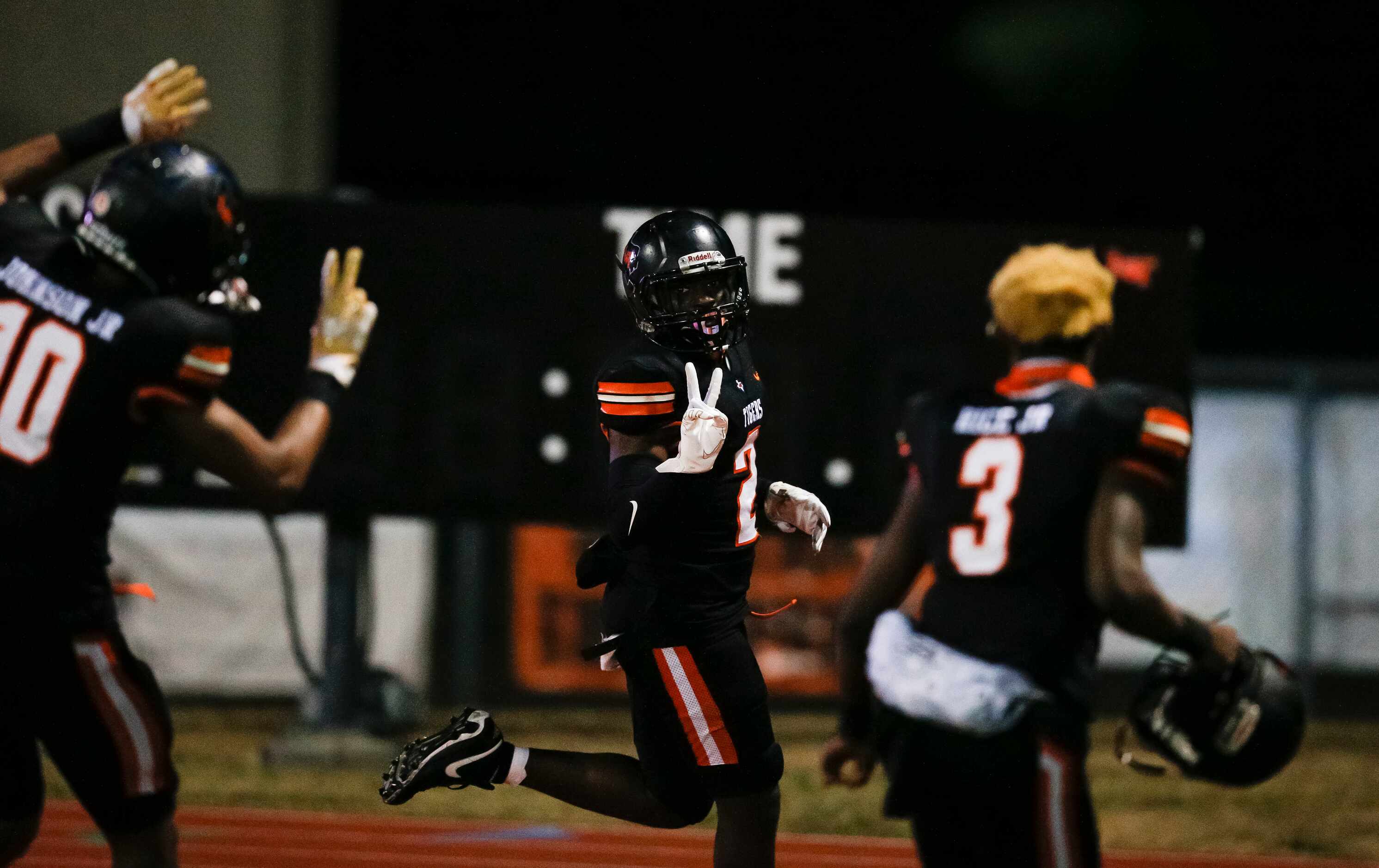 Lancaster senior defensive back Davion Hodge (2) celebrates returning a blocked field goal...