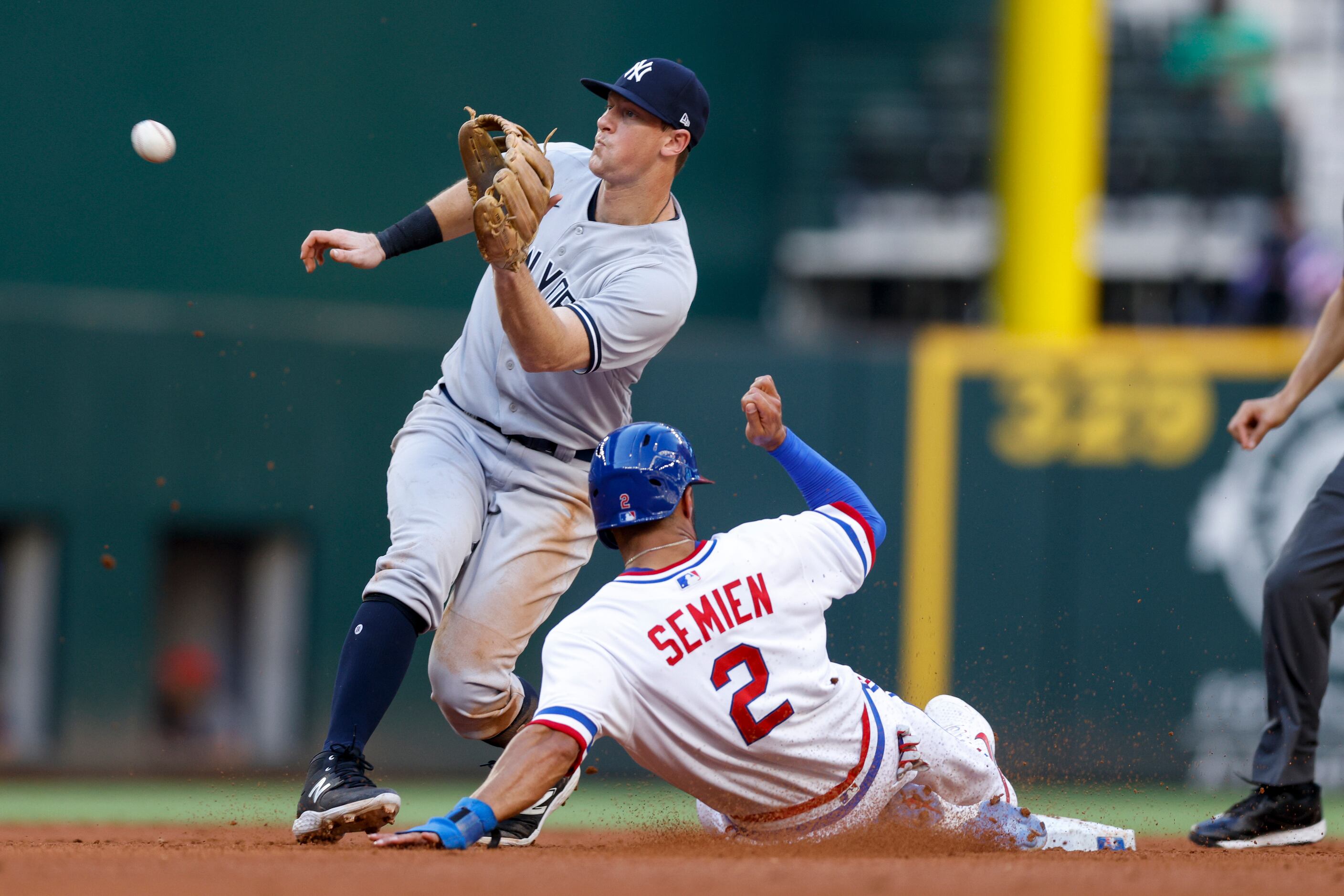 Texas Rangers second baseman Marcus Semien (2) is caught stealing at second base by New York...