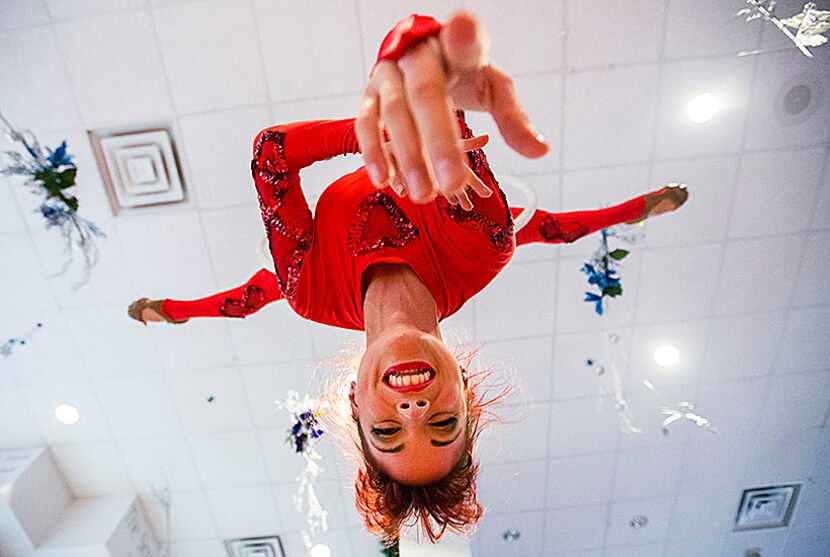  Kelli Brown performs on a hula-hoop hung from the ceiling in the lobby before the annual...