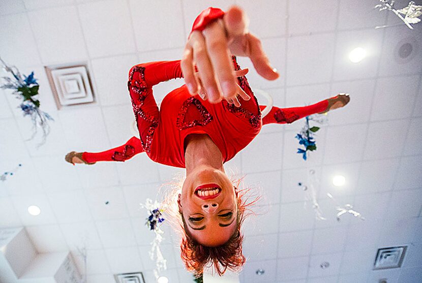  Kelli Brown performs on a hula-hoop hung from the ceiling in the lobby before the annual...