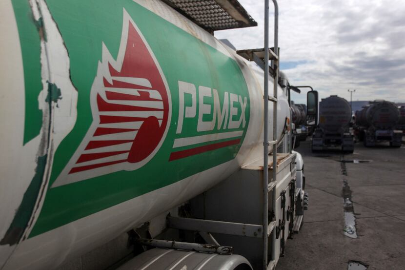 A tanker truck waits at the storage and dispatch terminal of Petroleos Mexicanos (Pemex),...