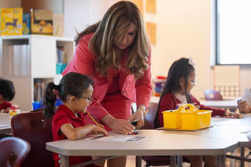 Dallas ISD superintendent Stephanie S. Elizalde gives first-grade student Laya Sweeny some...