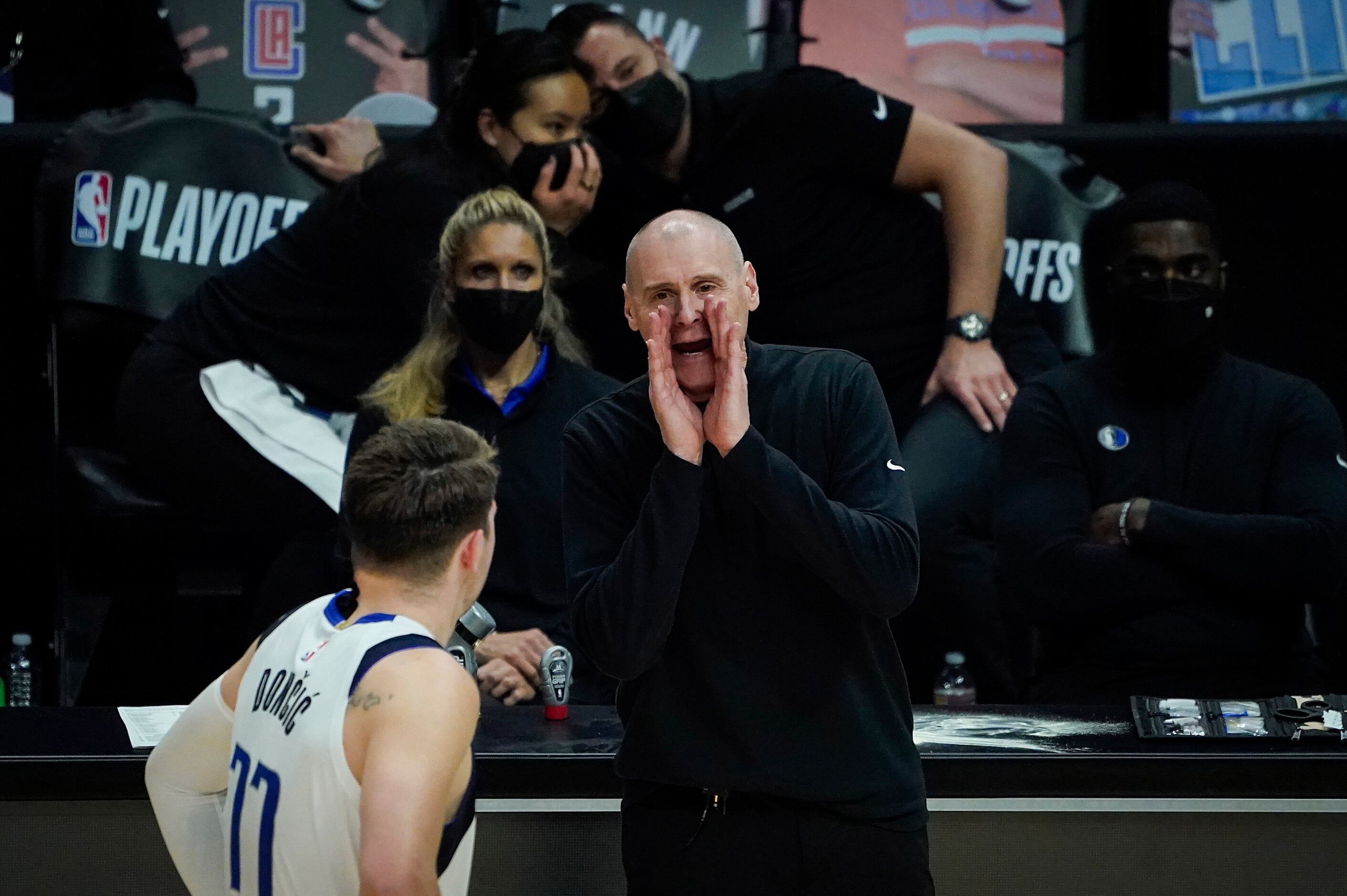 Dallas Mavericks head coach Rick Carlisle gives directions to guard Luka Doncic during the...