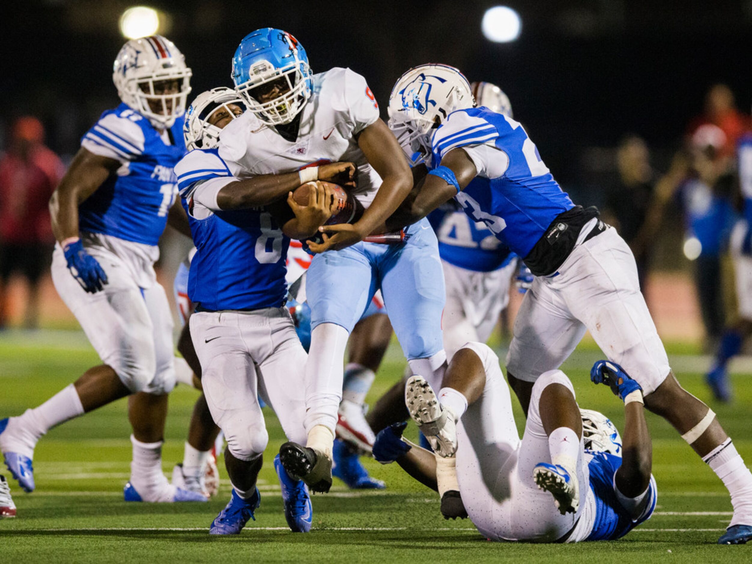 Skyline quarterback Darryl Richardson (9) is sacked by Duncanville linebacker Jadarius...