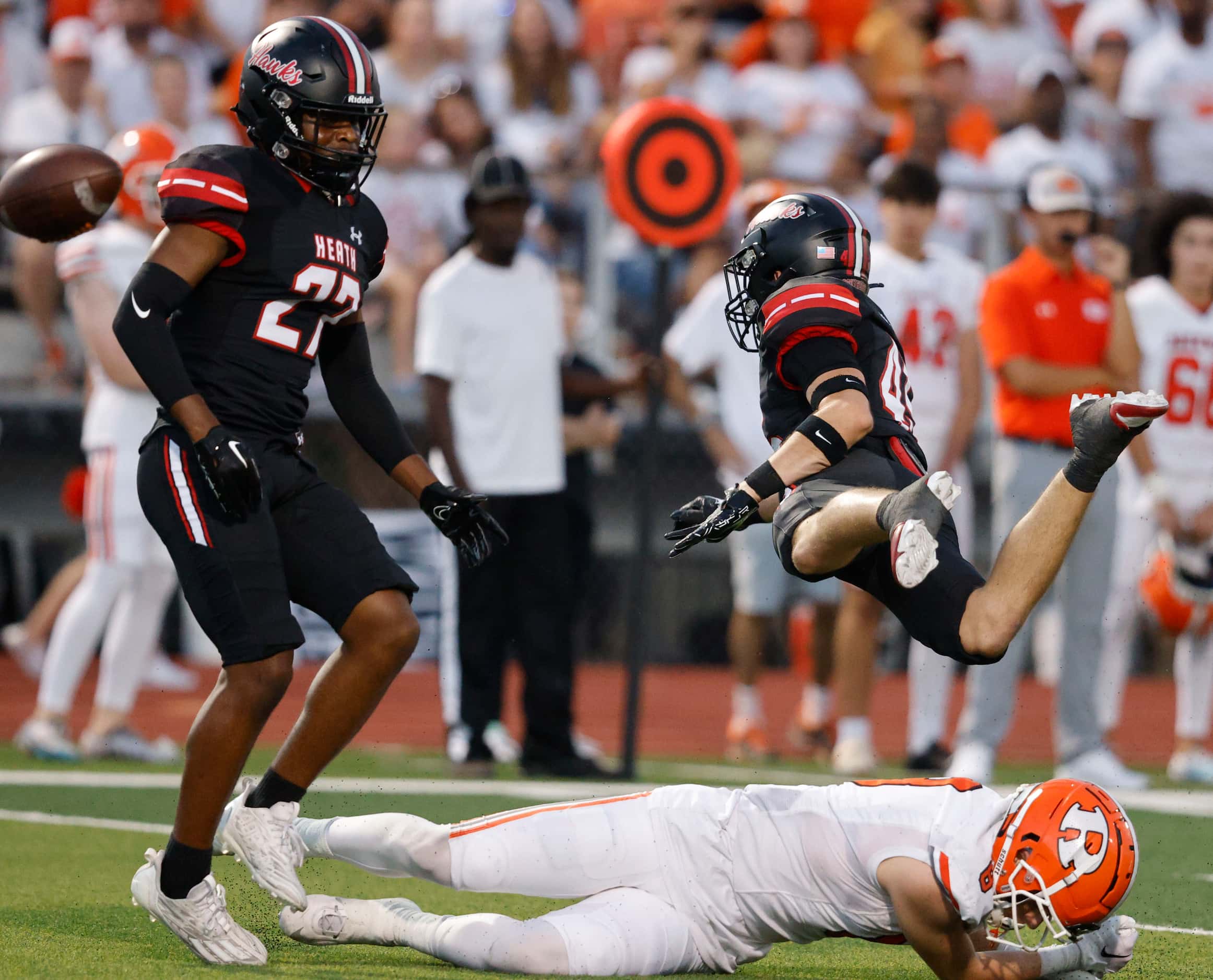 Rockwall's Tristan Gooch (8), down, fails to make the catch against Rockwall-Heath's Chase...