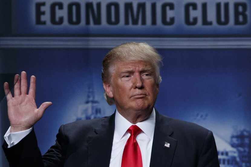Republican presidential candidate Donald Trump waves after delivering an economic policy...