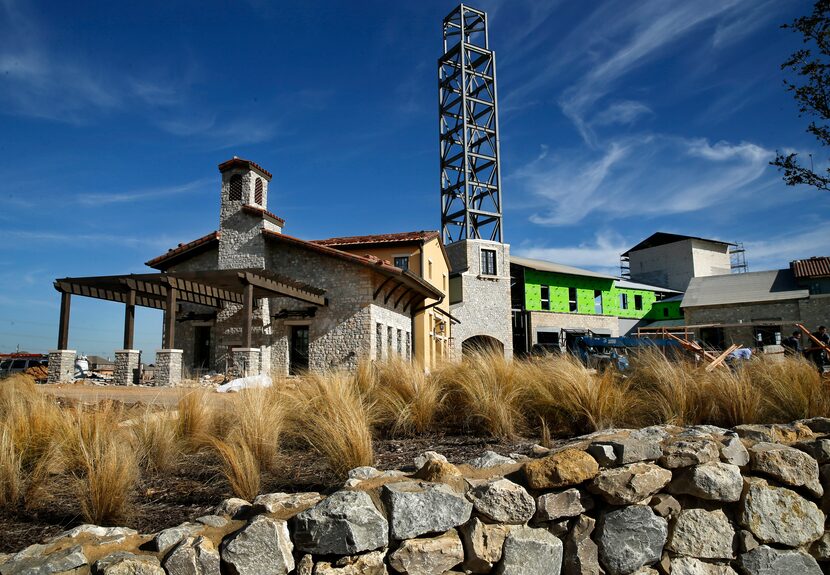 A retail and office building under construction at State Highway 114 and Davis Boulevard in...