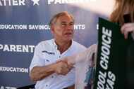 Governor Greg Abbott hosts a tailgate at the First Dallas Academy football game at the First...