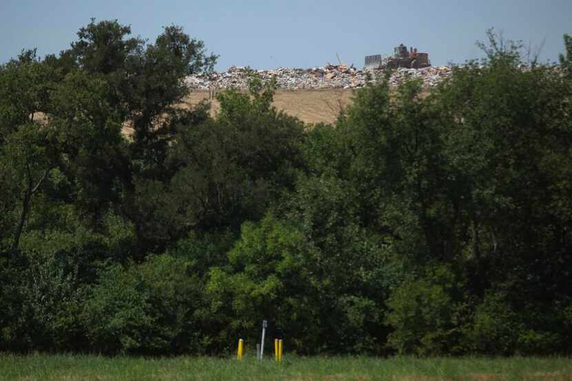 Bulldozers  at DFW landfill can be seen from Camelot Landfill above and across the Elm Forks...