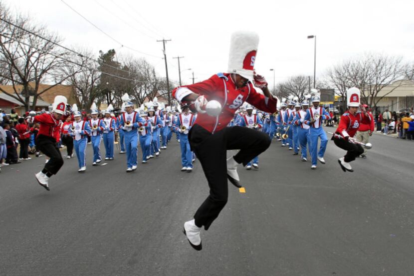 Skyline High School drum major Lydell McLemore leapt in the air during the January 2012...